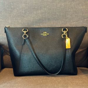 Coach black tote. Excellent condition. Black with gold tone accents.